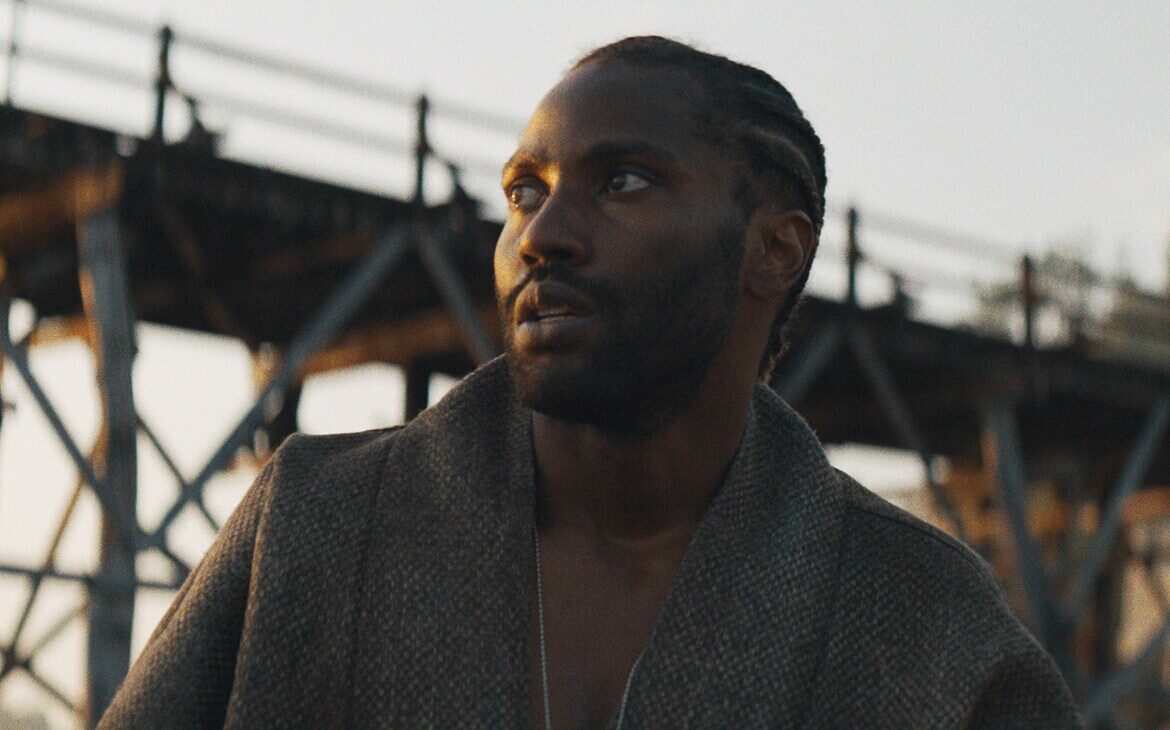 (Image Credits: John David Washington as Joshua in 20th Century Studios' THE CREATOR. Photo courtesy of 20th Century Studios. © 2023 20th Century Studios. All Rights Reserved.)