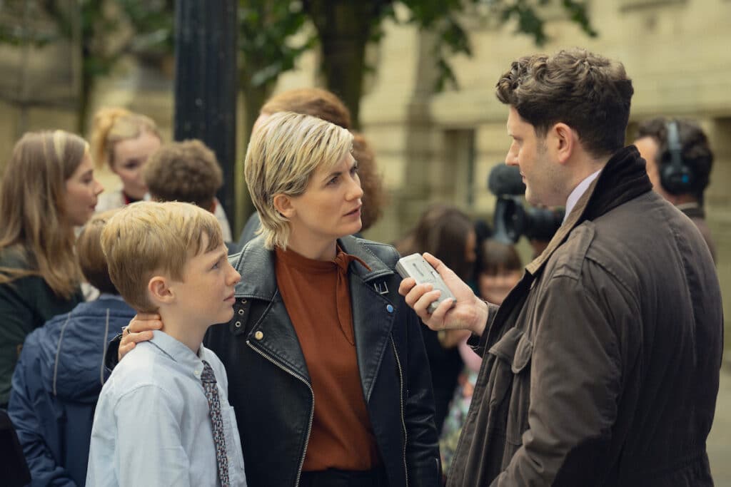 Toby Eden as Connor and Jodie Whittaker as Susan. (Photo Credit: Ben Blackall/Netflix)